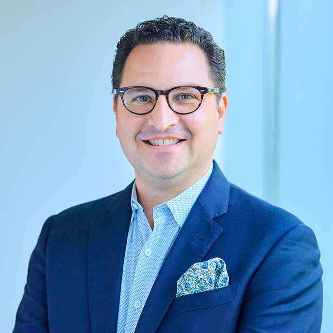 Professional headshot of Niko Apostal, Managing Broker at Essex Three-Twelve.
