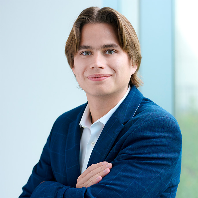 Quinn Evans, Associate Broker at Essex Three-Twelve, guiding clients through multifamily transactions in Chicago.
